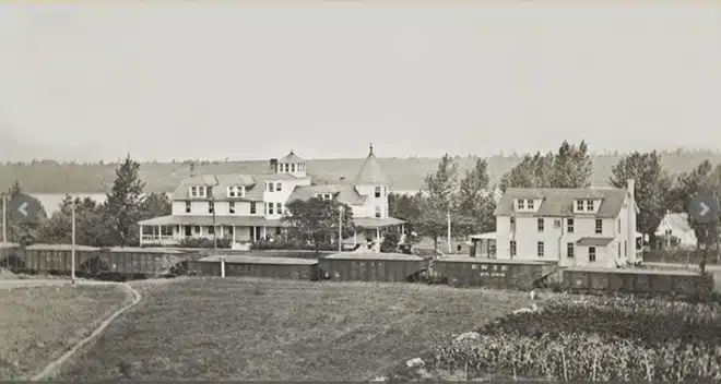 Naomi Pines House with Freight train in front Tobyhanna Historical Society