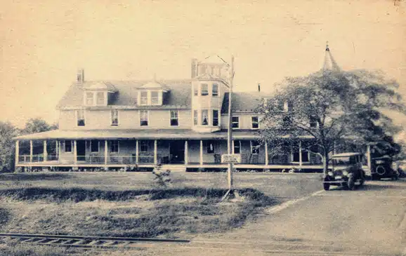 Naomi Pines House with train in front MCHA